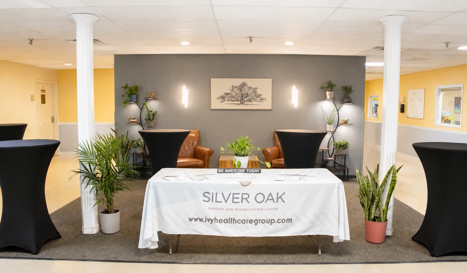 A bright, welcoming lobby and common area with comfortable seating at Silver Oak